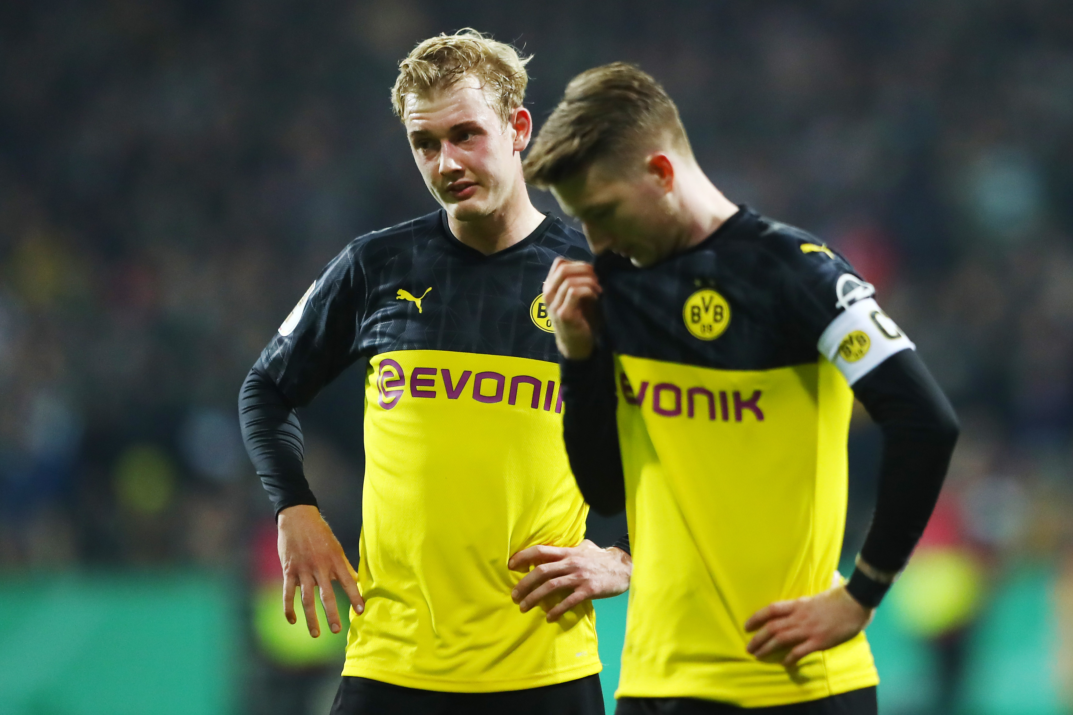BREMEN, GERMANY - FEBRUARY 04: Julian Brandt and Marco Reus of Borussia Dortmund react during the DFB Cup round of sixteen match between SV Werder Bremen and Borussia Dortmund at Wohninvest Weserstadion on February 04, 2020 in Bremen, Germany. (Photo by Martin Rose/Bongarts/Getty Images)